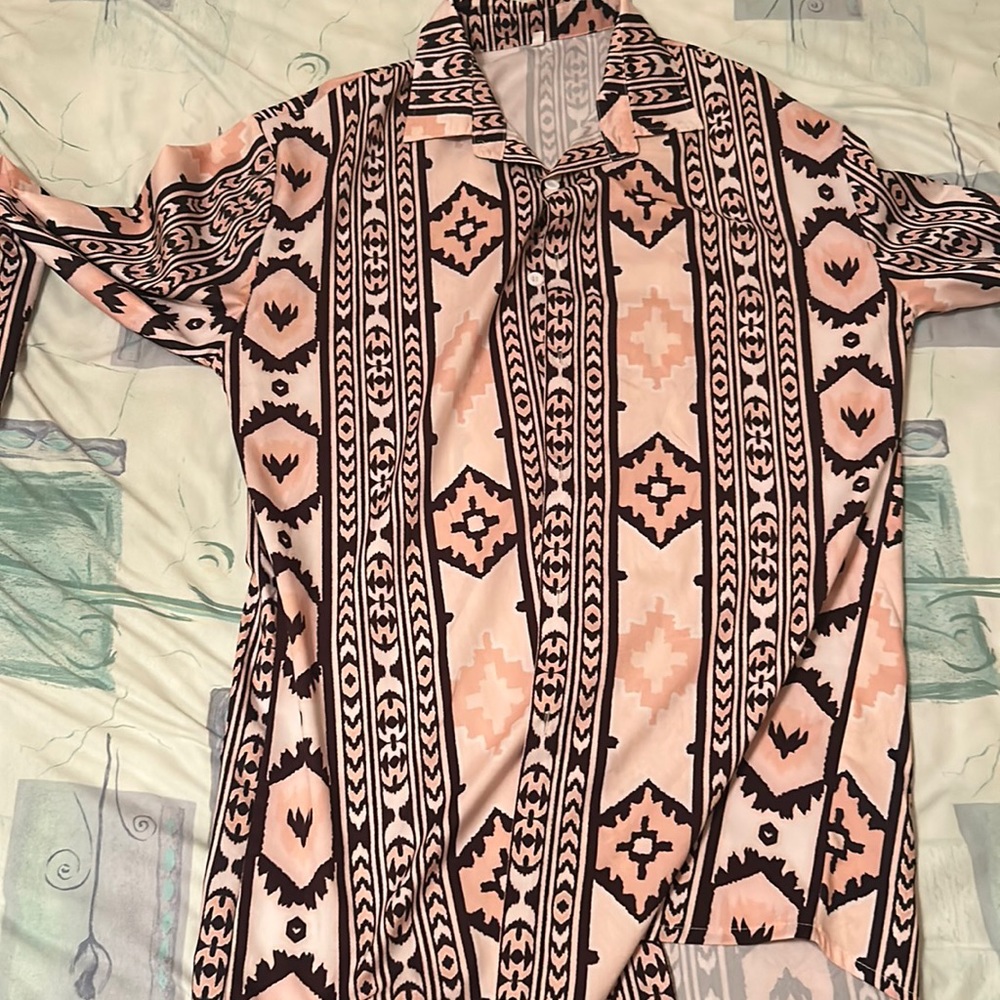 Multi colored Patterned button up. Worn less twice. Size medium